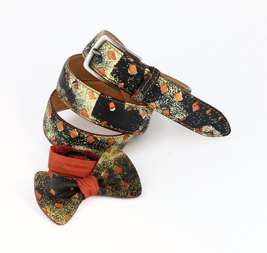 orange green and black sewed belt with his matcing bow tie