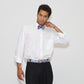 our model wearing black pants and a white shirt with painted bow tie and belt in a white background