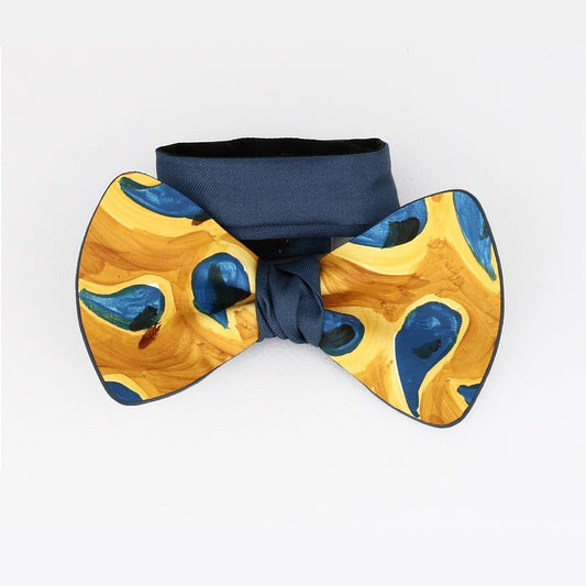 bow tie with drops of water painted on a yellow background