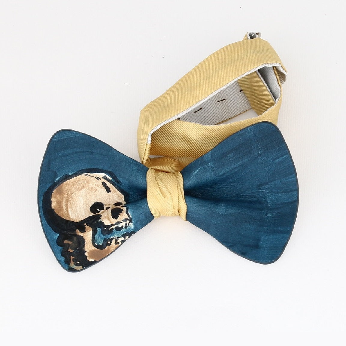 bow tie with skull drawn on a blue background